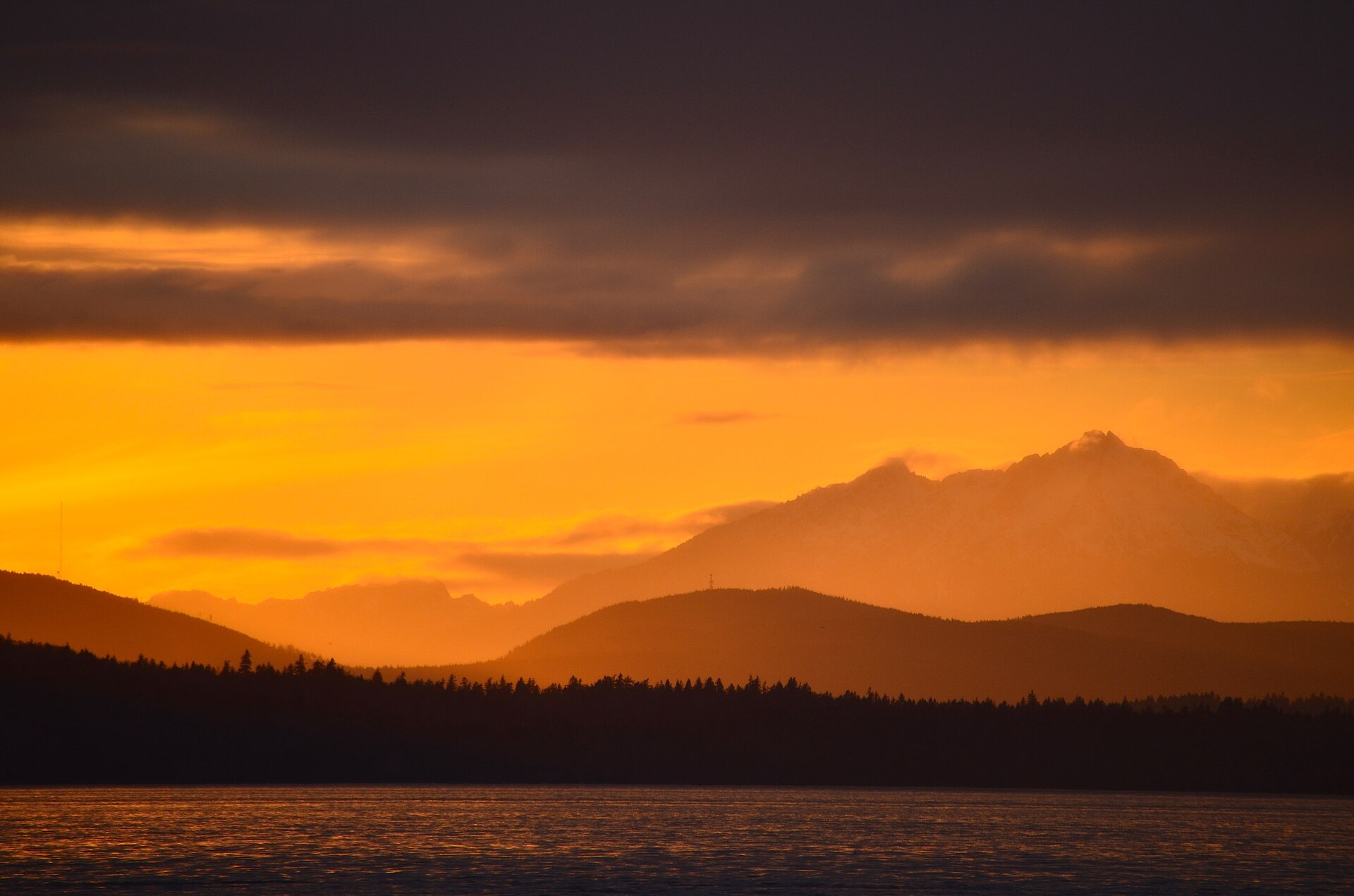 Olympic Mountains glowing gold at sunset over Puget Sound, illustrating prayers for strength during difficult times